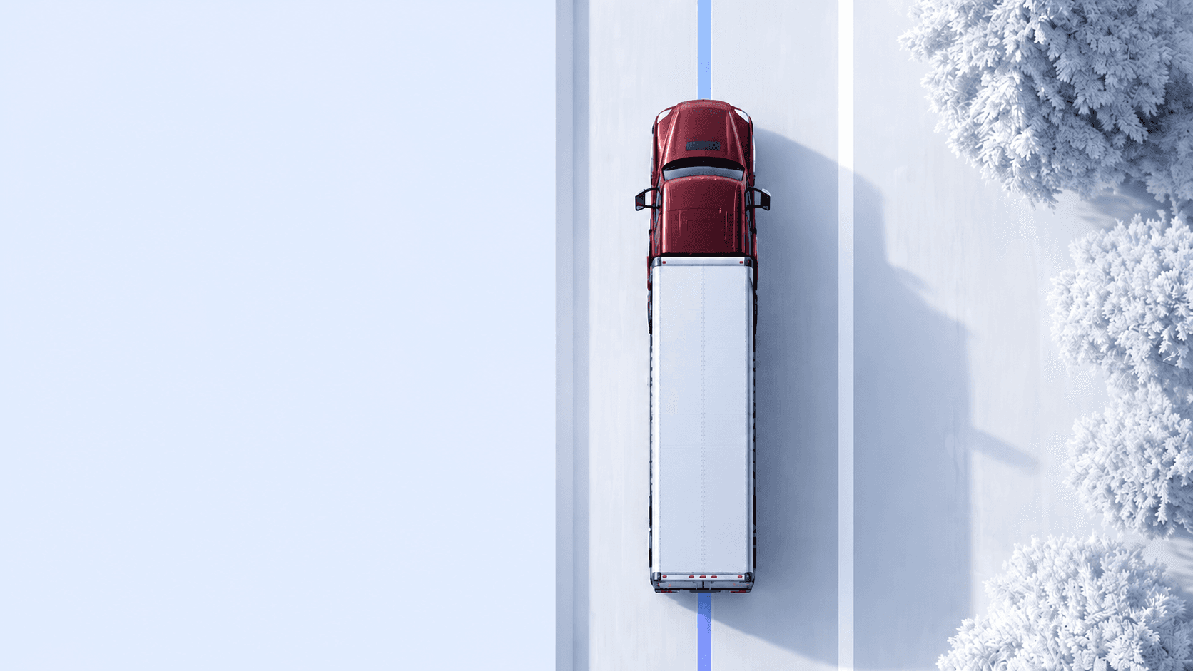 Top-down view of a red semi truck on a snowy road